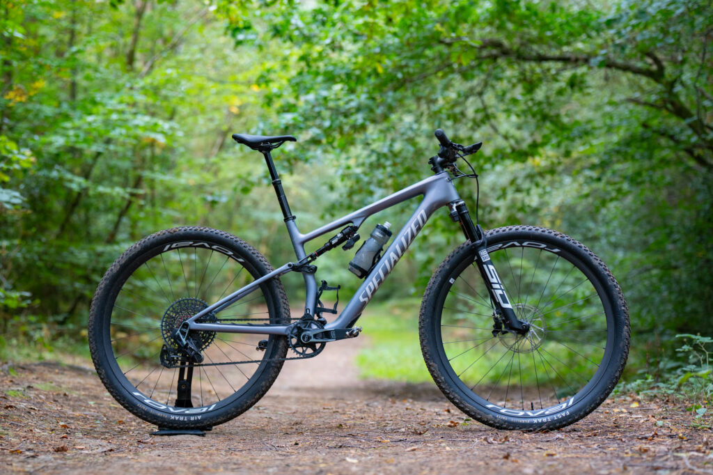 a specialized epic 8 pro cross country mountain bike side on in the woods