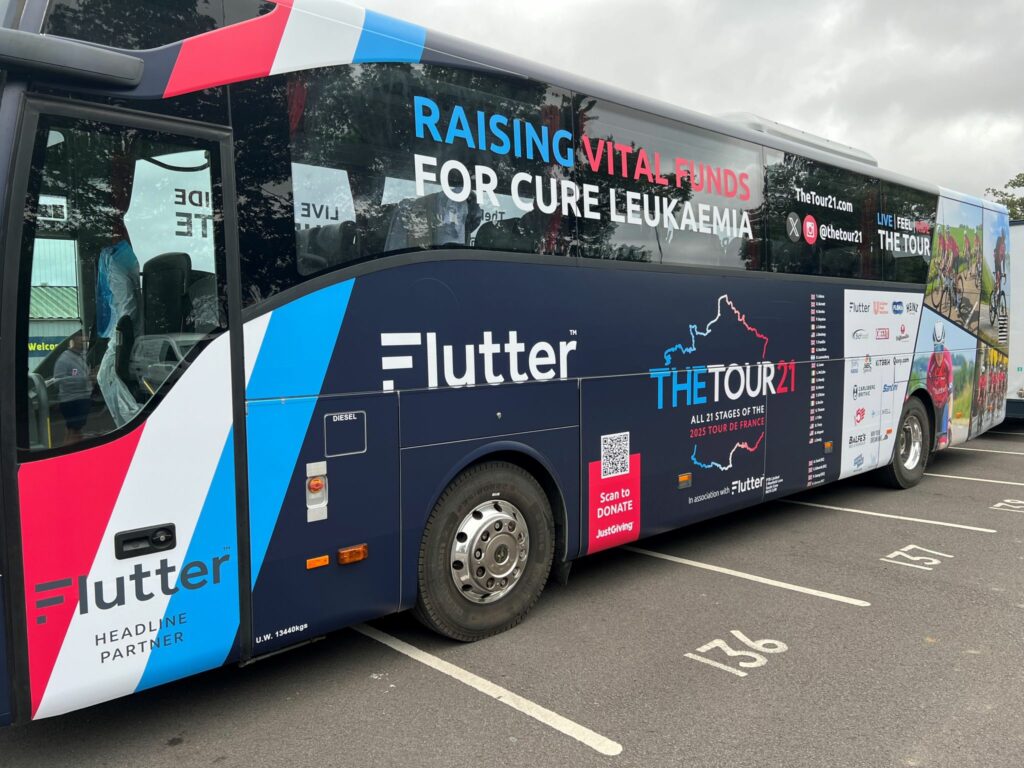 The Tour21 Rider Tour Bus, including sponsor logos and Cure Leukaemia info.