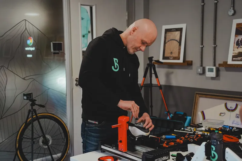 Detailed cockpit and cleat alignment during a bike fitting