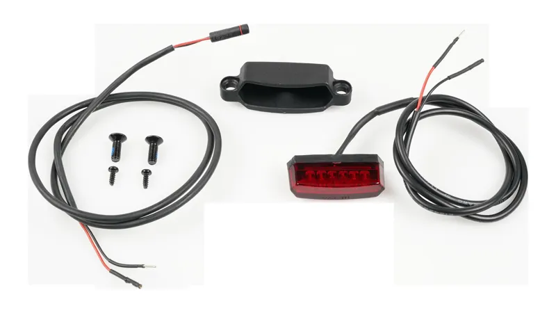Specialized LGT REAR SPECIALIZED FC28 TAILLIGHT 6V SADDLE MOUNTED W/ BROSE LIGHT WIRE PLASTIC CRADLE and MOUNTING BOLTS in Red